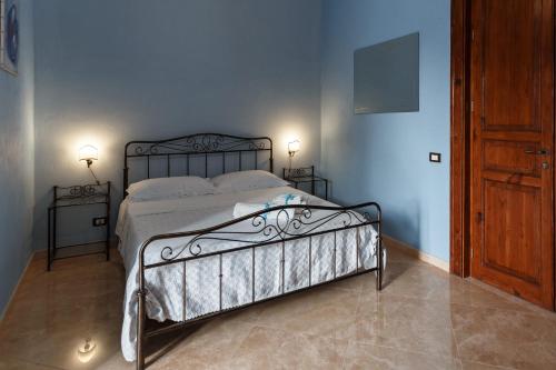 Letto o letti in una camera di B&B Batarà - "La Terrazza del Centro"