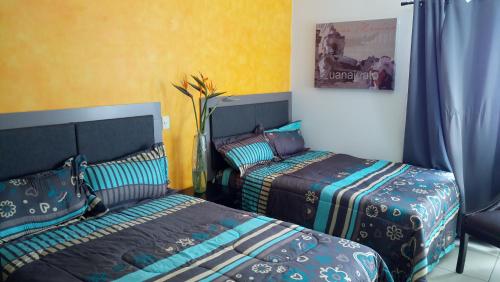 Postel nebo postele na pokoji v ubytování Suites Sta Tere
