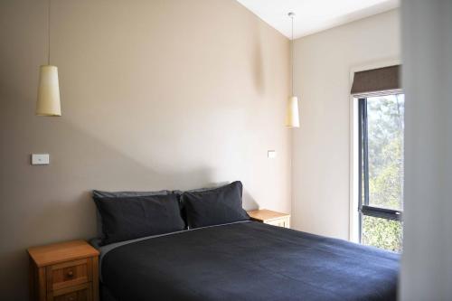 Ένα ή περισσότερα κρεβάτια σε δωμάτιο στο Discovery Resorts - Cradle Mountain