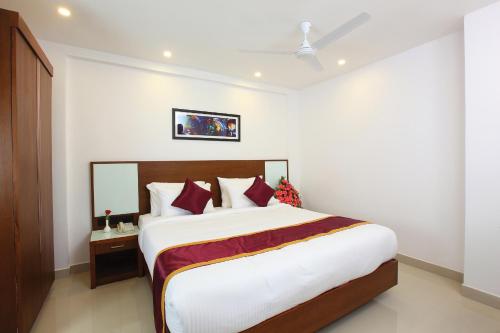 Ένα ή περισσότερα κρεβάτια σε δωμάτιο στο Hotel Park Residency