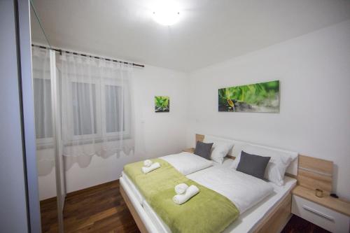 Кровать или кровати в номере Apartment's Tea & Nevio