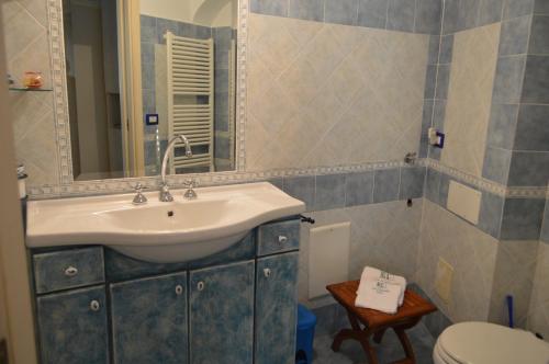 a bathroom with a sink and a toilet at La Casarella Apartment Positano - Stunning View in Positano