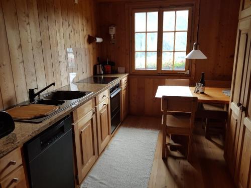 a kitchen with a sink and a counter top at Ferienwohnung am Bach in Münster