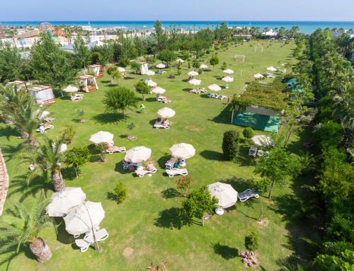 an aerial view of a park with people laying on the grass at Melas Lara Hotel in Lara