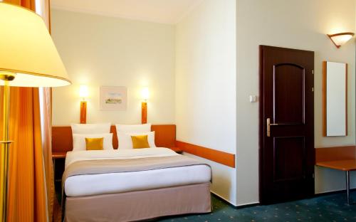 Katil atau katil-katil dalam bilik di Hotel Zamojski