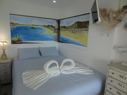 En eller flere senge i et værelse på Akisol Sesimbra Beach III