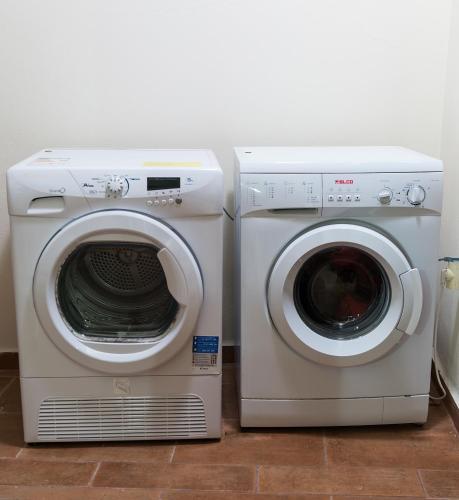 two washing machines and a dryer in a room at Panorama Villa Private Pool, BBQ, Parking in Sitia