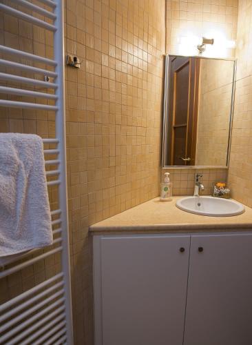 a bathroom with a sink and a mirror at Panorama Villa Private Pool, BBQ, Parking in Sitia