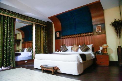 Krevet ili kreveti u jedinici u okviru objekta Grand Heritage Narmada Jacksons