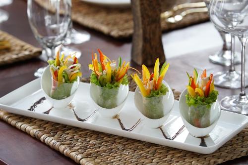 a white tray with flowers on a table at Sabara Angkor Resort & Spa in Siem Reap