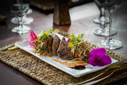 a plate of food sitting on a table at Sabara Angkor Resort & Spa in Siem Reap