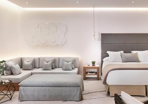 a living room with two beds and a couch at Nobu Hotel Marbella in Marbella