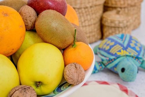 a bowl of fruit sitting on a table at La Tortuga in Agropoli