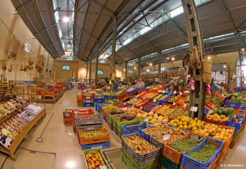 a large market filled with lots of fruits and vegetables at Yiayia's House Limassol city in Limassol