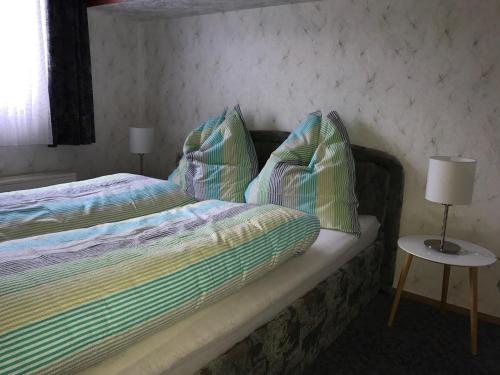 a bedroom with a bed with two pillows on it at Wohnung Alpencottage in Bad Aussee