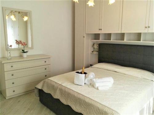 a bedroom with a bed with a stuffed animal on it at A Ca Du Barba in Monterosso al Mare
