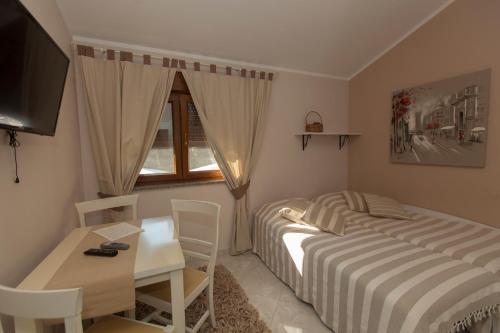 Ένα ή περισσότερα κρεβάτια σε δωμάτιο στο Guest House Navetta