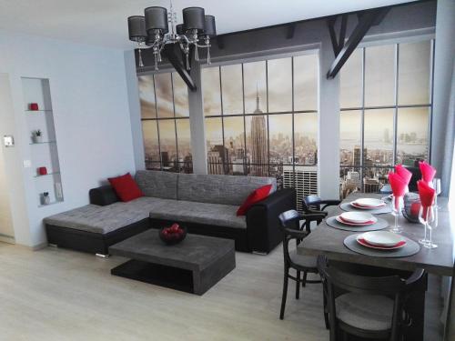 a living room with a couch and a table at V-Apartments in Ostend
