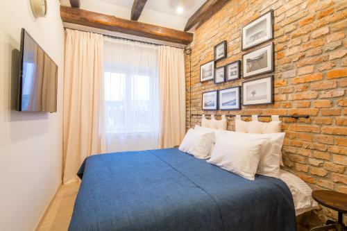 Postel nebo postele na pokoji v ubytování Revelton Residence