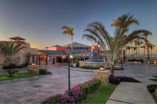 a resort with palm trees and a building at Hyatt Vacation Club at Sirena del Mar in Cabo San Lucas
