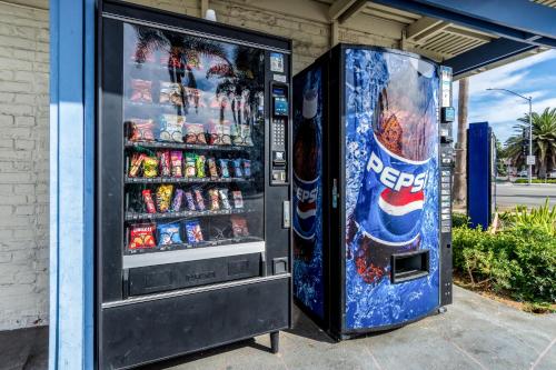 two vending machines are sitting next to each other at Pacific Inn in Oceanside