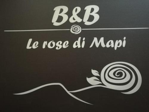 a chalkboard with a sign that says bbb le nose dmap at Le rose di Mapi in Mango