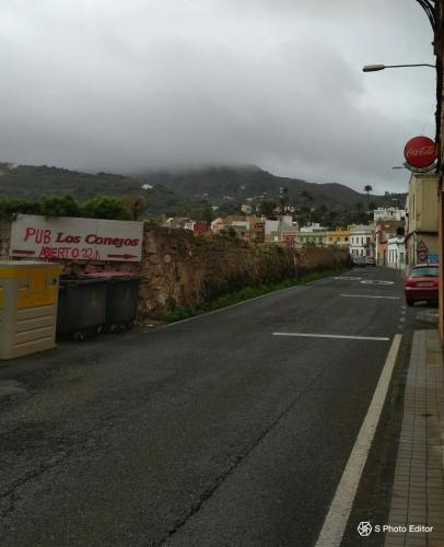 a street with a sign on the side of the road at Residencia Los Conejos - Bike & Motorbike in Las Palmas de Gran Canaria