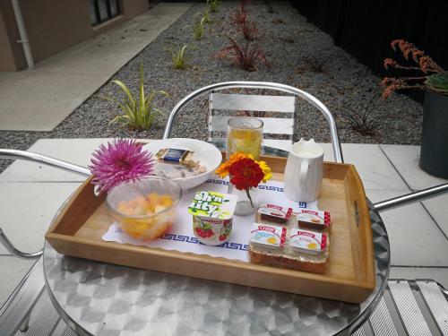 a tray of food on top of a table at Abbella Lodge Motel in Christchurch