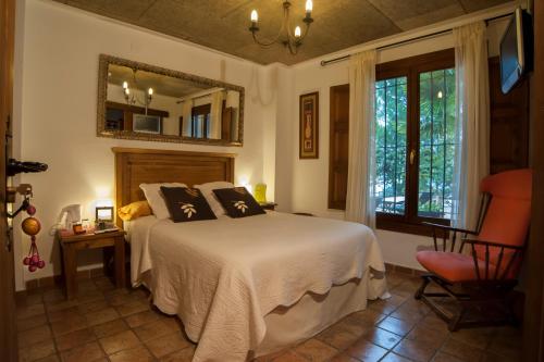En eller flere senge i et værelse på Casa Bons Aires