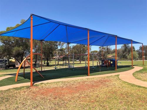 a picnic table with a tent on top of it at Discovery Parks - Kalgoorlie Goldfields in Boulder