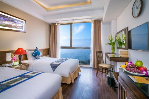 Giường trong phòng chung tại Amazing Hotel Sapa