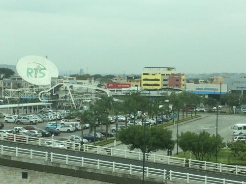 a view of a parking lot with a roller coaster at Hotel Garzota Inn in Guayaquil