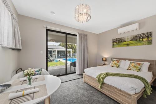 a bedroom with a bed and a table at The Wellington Bed and Breakfast in Longford