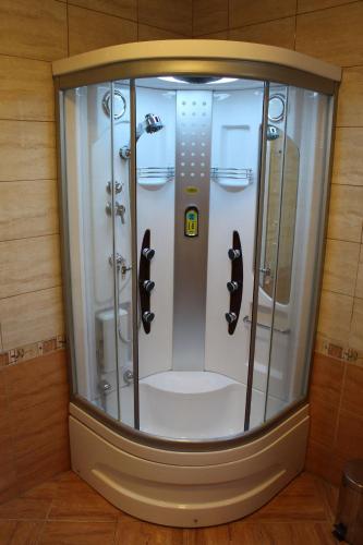 a shower with four stalls in a room at Starigrad House in Starigrad