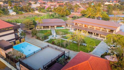 an overhead view of a building with a swimming pool at AU Place Hotel in Loei