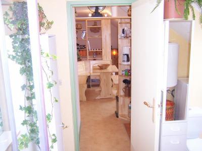 an open door to a room with a kitchen at La maison de poupet in Salins-les-Bains