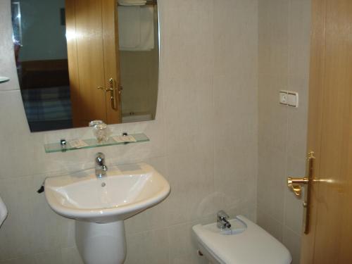a bathroom with a sink and a toilet at Hostal Mediterraneo in El Ejido