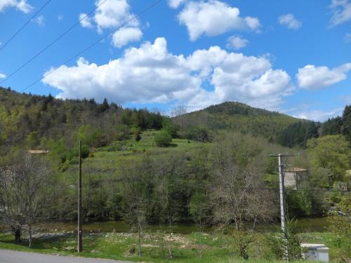 a view of a mountain from a road at Gîte-La Combelle in Dornas
