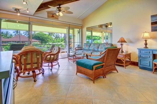 a living room with a couch and chairs and a table at Maui Kaanapali Villas E290 in Lahaina