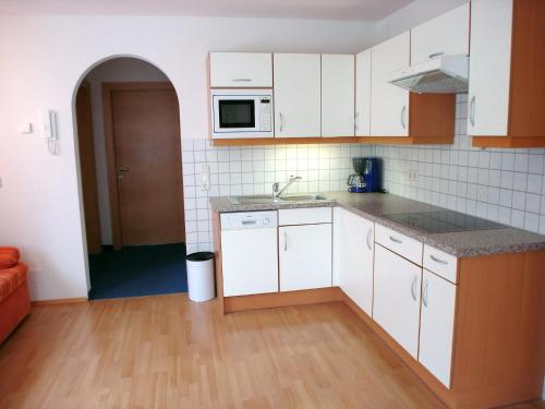 Kuchyň nebo kuchyňský kout v ubytování Apart Alpenkönig - inklusive Sommercard