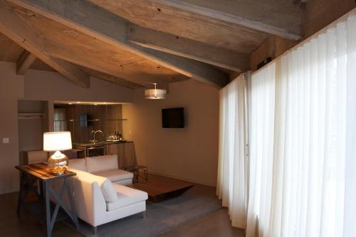 a living room with a white couch and a table at The Roundhouse in Beacon