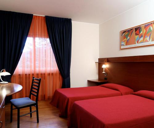 Un pat sau paturi într-o cameră la Hotel Ristorante Fatur