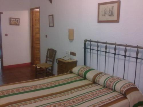 Postel nebo postele na pokoji v ubytování Posada de Jose Mª El Tempranillo