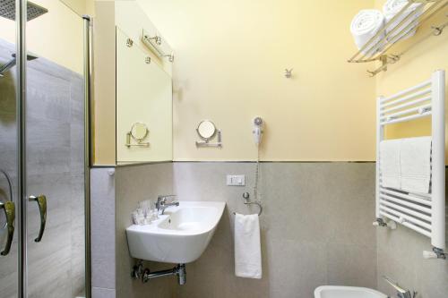 a bathroom with a sink and a shower at Ruins B&B in Ercolano