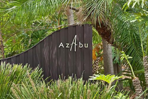 a black sign with the words akubu on it at Azabu Retreat & Spa in Byron Bay