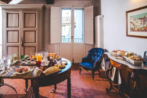 a room with a table with food on it at Callegherie 21 Boutique B&B in Imola
