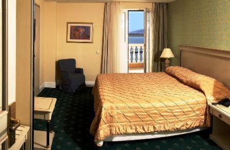 Postel nebo postele na pokoji v ubytování Nafsika Palace Delphi-Itea