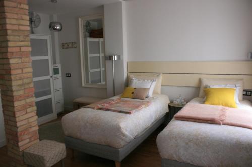 Ένα ή περισσότερα κρεβάτια σε δωμάτιο στο LarDviura