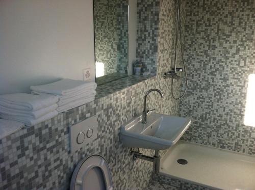 Koupelna v ubytování Auberge de Founex