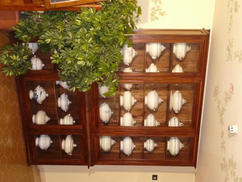 a wooden display cabinet filled with white clams at Hotel San Luca in Spoleto